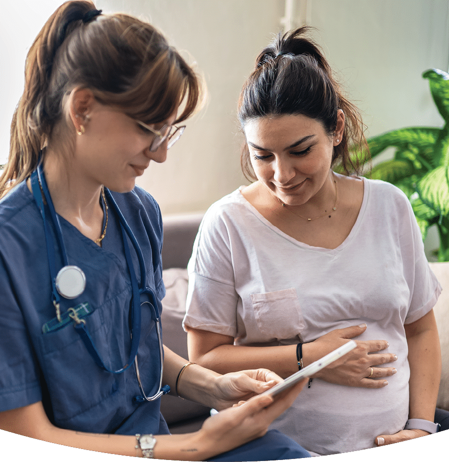 Home healthcare nurse visits pregnant woman at home
